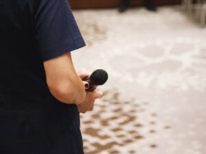 Microphone in speaker's hands at conference