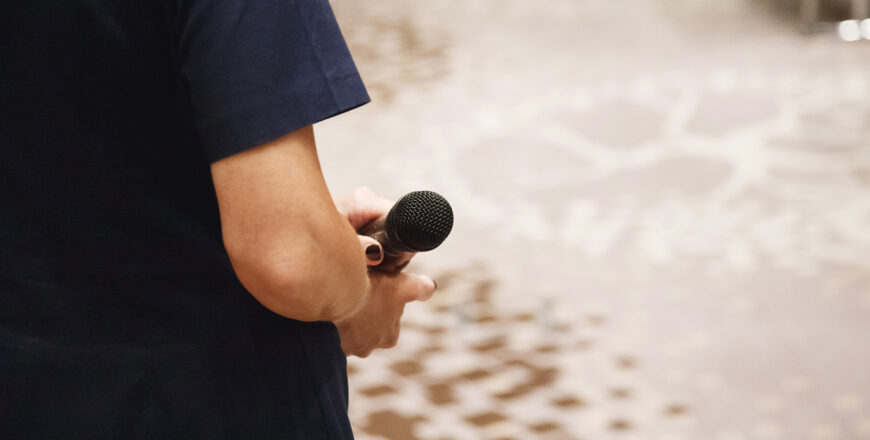 Microphone in speaker's hands at conference